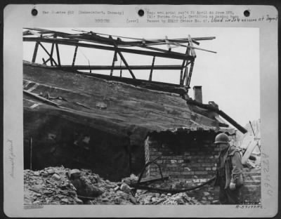 Consolidated > Bearing Manufacture, An Ultra-Precision Industry Was Found By American Observers To Be Reduced To Relative Primitive Housing.  A Tarpaulin, Weighted With Bricks (Above And Left Of Soldiers Helmet) Housed Part Of Vkf #2.  Schweinfurt, Germany.