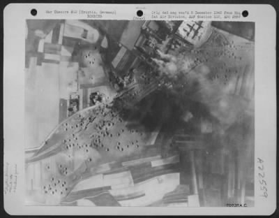 Consolidated > Bombs, Dropped By Planes Of The 386Th Bomb Group, Explode On Enemy Installations At The Triptis, Germany Marshalling Yards During A Raid On 18 April 1945.  Note Crater Holes Made By Bombs On Former Raids.