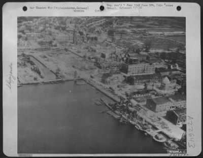 Consolidated > Wilhelmshaven'S Shipyards In Ruins -- Wilhelmshaven'S Shipyards Show The Wreckage Wrought By Planes Of The Us 8Th Af During The Strategic Bombing Campaign.  The German Curiser 'Koln' Lies In The Basin, A Sunken Wreck.  Germany.