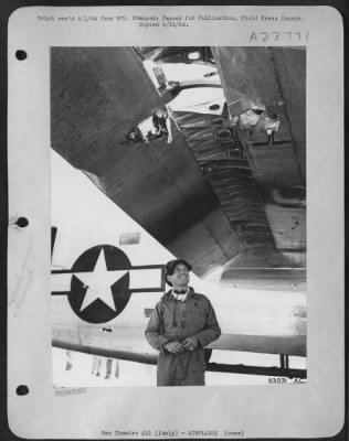 Consolidated > 2nd Lt. Bill A. Disbrow, of 3333 E. 40th St., Sacramento, Calif., stands under the wing of his Consolidated B-24 Liberator looking up at the damage it sustained while on a mission over Vienna on 26 June 44, as heavy bombers of the 15th AF attacked