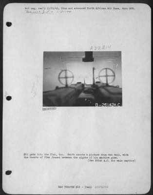 Consolidated > #61 gets into the flak, too. Smith shoots a picture from the tail, with the bursts of flak framed between the sights of his machine guns.