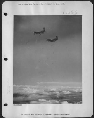 Thumbnail for Consolidated > With German flak bursting black against the white clouds, 12th AAF Martin B-26 Marauders dropped anti-personnel bombs on Nazi positions on the Nettuno bridgehead recently. Despite the almost complete cloud cover under which the Germans were launching