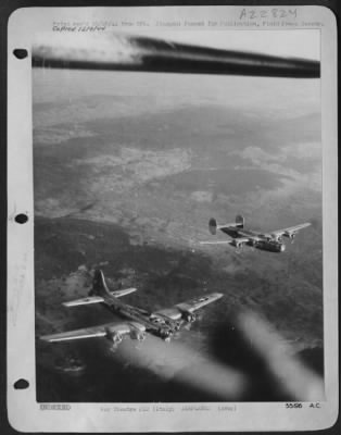Consolidated > ITALY-A Consolidated B-24 Liberator and a Boeing B-17 Flying Fortress, both of the 15th Air Force fly in the same formation when they return from an attack against targets in Vienna on October 7, 1944.