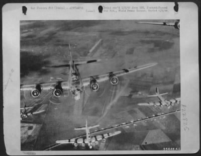 Consolidated > Boeing B-17 Flying Fortresses of the 15th Air Force form up on their way to continue the air offensive against strategic hun targets deep in enemy territory. This photo was taken from the tail gun position of a preceding fortress. ITALY.