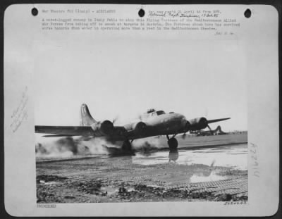 Thumbnail for Consolidated > A water-logged runway in Italy fails to stop this Flying Fortress of the Mediterranean Allied Air Forces from taking off to smash at targets in Austria. The Fortress shown here has survived worse hazards than water in operating more than a year in