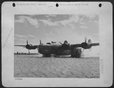 Consolidated > This is not a new amphibious plane taking off, but a B-24 Liberator of the Mediterranean Allied Air Forces as it taxies down the runway of its base in Italy. Heavy rains turned the field into a sea of mud.