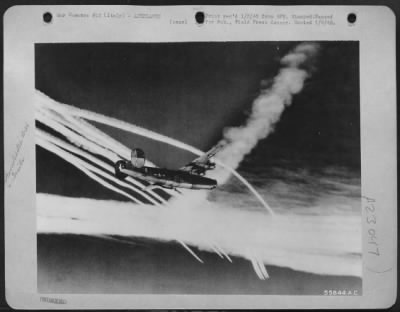 Consolidated > ITALY--Consolidated B-24 Liberators head for Vienna, Austrial S/Sgt. Richard L. Troger, of Hutchinson, Kan., 15th Air Force Aerial Photographer, took this picture of vapor trails from the attacking formation. Diagonal vapor trails are from Lockheed