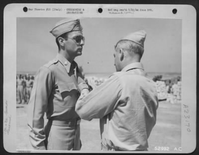 Consolidated > Lt. Col. Charles F. McKenna III, One Stover Avenue, Belham, N.Y., is decorated with Distinguished Flying Cross "For Extraordinary achievement in aerial flight as pilot of a Consolidated B-24 type heavy bomber," by Maj. Gen. Nathan F. Twining