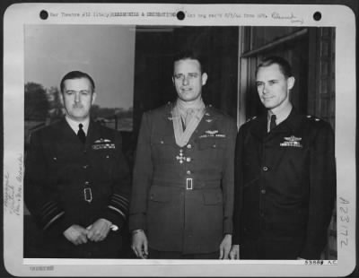 Consolidated > Air Chief Marshall Sir Leigh-Mallory shown with Col. Elliot Roosevelt and Maj. Gen. Hoyt C. Vandenburg after the award of the CBE (Commander British Empire) to Col Roosevelt for his work with the Photo-reconnaissance Unit in the Mediterranean