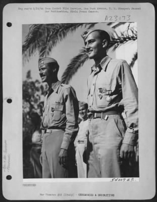 Consolidated > These two members of the 1st Combat Camera Unit, 15th Air Force, Italy, were shot down over Rumania, languished in prisoner of War camps, and then flown back to Italy when the Balkan Country surrendered. Left to right: 1st Lt. Sherwood A. Mark