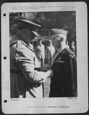 Consolidated > ITALY-General Sir Henry Maitland Wilson, supreme allied commander in the Mediterranean theatre places the Order of Knight of the British Empire on Major General John K. Cannon, Commanding General of the 12th Air Force. This award was made to the