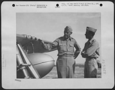 Thumbnail for Consolidated > While on an inspection tour of 15th Air Force groups in Southern Italy, Lt. General B.M. Giles, Chief of Staff of U.S. AAF, visited this veteran North American P-51 Mustang fighter base of the 52nd Fighter Group, where he is shown chatting with Col.