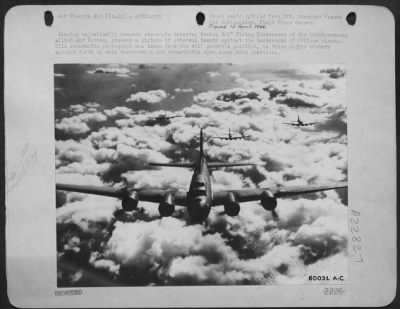 Thumbnail for Consolidated > Winging Majestically Towards Strategic Targets, Boeing B-17 Flying Fortresses Of The Mediterranean Allied Air Forces, Present A Picture Of Ethereal Beauty Against The Background Of Billowy Clouds.  This Remarkable Photo Was Taken From The Tail Gunner'S Po