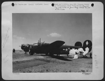 Consolidated > Its Hydraulic System Shot Out By Flak Over The Ferrara Railroad Bridge In Northern Italy, This Consolidated B-24 Liberator Bomber Of The 15Th Af Landed With The Aid Of Parachutes Preventing The Lib From Overshooting The Landing Strip.