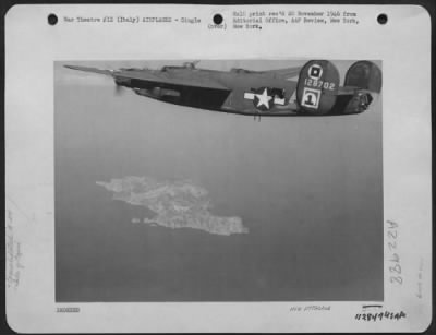 Thumbnail for Consolidated > Winging Majestically Homeward, This Consolidated B-24 Liberator Of The 15Th Af Flies Over The Famous Isle Of Capri In Italy, After Completing Its Mission Deep In The Heart Of Enemy Territory.