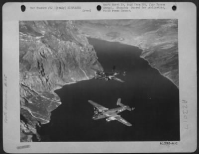 Consolidated > 12Th Af North American B-25 Mitchell Bombers In 'Battle Of The Brenner' Cross A Section Of Lake Garda In Northern Italy While Enroute To A Rail Bridge Target On The Important Brenner Pass Line.