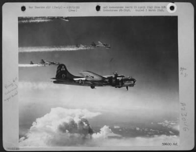Consolidated > Boeing B-17 "Flying Fortress" Of The 15Th Af Leave A Pattern Of Vapor Trails As They Leave An Enemy Installation In Northern Italy.