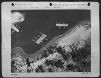 Consolidated > This Photos Shows Pontoon Bridge Sections Awaiting Transport To The Huns Across The Po River, In Italy, Which At One Time Was Supposed To Have Been Their Second Line Of Defense After Bologna, But The Allies Are Chasing Them Too Fast For Them To Stop At Th