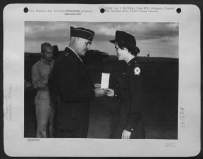 Consolidated > Major General John K. Cannon, Commanding General Of The 12Th Af, Presents The Distinguished Flying Cross With Oak Leaf Cluster To Lt. Ruth W. Raup, Of 4147 Garfield Ave. South, Minneapolis, Mn, Widow Of Major Robert W. Raup, Of Milton, Penn., A Pilot In A