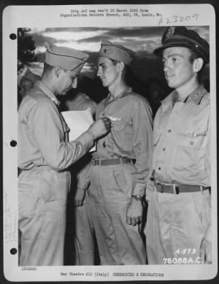 Consolidated > Major Humbrecht Presents An Award To Lt. Jackson Of The 90Th Photo Reconnaissance Wing During A Ceremony Somewhere In Italy.