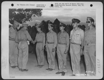 Consolidated > Major Humbrecht Presents An Award To Lt. Berry Of The 90Th Photo Reconnaissance Wing During A Ceremony Somewhere In Italy.