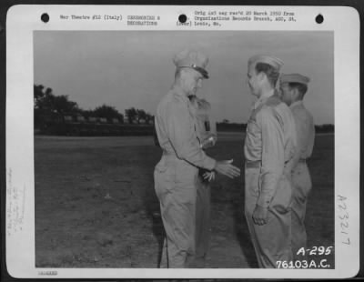 Consolidated > Lt. Gen. Carl A. Spaatz Congratulates Capt. Humbrecht For Receiving The Distinguished Flying Cross At A Ceremony Somewhere In Italy.  90Th Photo Reconnaissance Wing.