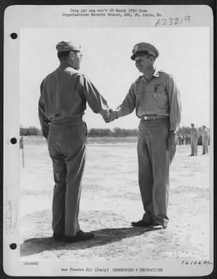 Consolidated > Major General Idwal H. Edwards Congratulates Colonel Karl Polifka On Receiving The Legion Of Merit During A Ceremony At An Air Base Somewhere In Italy.  90Th Photo Reconnaissance Wing.