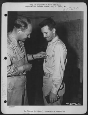 Consolidated > Capt. Harry R. Oakley Of The 90Th Photo Reconn Wing, Is Presented The Legion Of Merit By Colonel Karl Polifka During A Ceremony At An Air Base Somewhere In Italy.