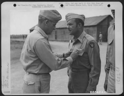 Consolidated > Major General Nathan F. Twining Presents Colonel H.P. Rush, Wing Commander With The 376Th Bomb Group At San Pancrazio, Italy, With The Silver Star For Gallantry In Action Against The Enemy.