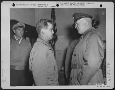 Consolidated > Gen. Henry H. Arnold, Chief Of The Air Force, Chats With Lt. Colonel Yancey S. Tarrant Of Brownwood, Texas, A Member Of The 64Th Fighter Wing, After Presenting Him With The Distinguished Service Cross During A Ceremony In The Pogmigliano Sector, Italy, On