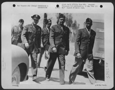 Consolidated > Lt. Gen. Ira C. Eaker, Commanding General Of The Mediterranean Allied Air Forces, Is Shown Here On An Inspection Tour Of The All Negro Fighting Group, With Officers Of That Unit.  Left To Right: Lt. Colonel Beaufort Buchanan, Executive Officer Of A Fighte