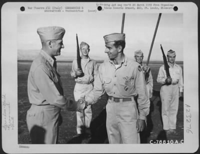 Consolidated > Major General Nathan F. Twining Presents The Distinguished Flying Cross To A Member Of The 94Th Fighter Squadron, 1St Fighter Group During A Ceremony At An Airbase Somewhere In Italy.