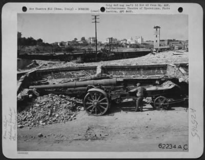 Thumbnail for Consolidated > Bomb damage to Ostiense Railroad Yards on the outskirts of Rome, Italy. Note gun in foreground.