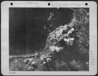 Consolidated > By deliberately hitting the hillside just above the road, B-24 Liberators of the U.S. Army 15th Air Force are here causing landslides which will block the shore highway at Terracina, Italy. This action supports the Allied Landings south of Rome by