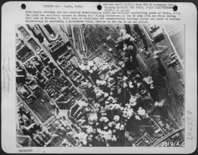 Consolidated > Bomb bursts covering the ball-bearing manufacturing plant and adjacent marshalling yards at Turin, Italy. The plant was seriously damaged by Boeing B-17 Flying Fortresses of the US Army 15th Air Force during this raid on November 8, 1943. Loss of