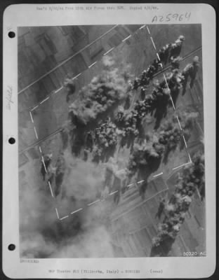 Thumbnail for Consolidated > Wherever the Luftwaffe bases its planes in the Battle for Italy, the bombers of the Strategic Air Force hunt them down, smash their fields and hangars. Bombs here are carpetting the landing area of Villaorba, in Northern Italy at the head of the