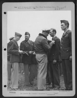 Consolidated > Brig. Gen. Robert D. Knapp presents awards at Solenzara, Corsica 9 May 1944.