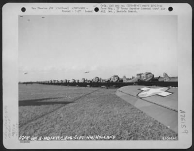 Consolidated > Douglas C-47s of the 9th Troop Carrier Command lined up on a field somewhere in Holland. 26 September 1944.