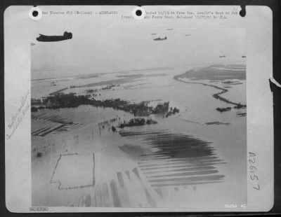 Consolidated > Consolidated B-24 Liberators over flooded Dutch countryside on way to Airborne Army 18 Sept 44.
