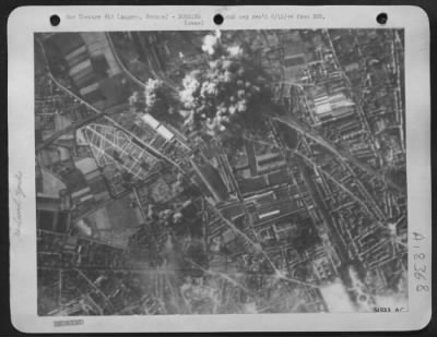 Thumbnail for Angers > ANGERS RAIL JUNCTION ATTACKED--At Angers in Northern France, U.S. 8th Air Force heavy bombers dropped large concetrations on a key rail junction 8 June 44. Bombs may be seen bursting on rail installations and choke point there.