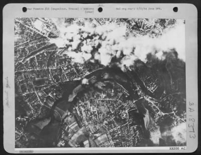 Thumbnail for Angouleme > At Angouleme in northern France, 8th USAAF heavy bombers dropped heavy concentrations on the rail marshalling yards there 15 June 44. Smoke and new bomb bursts combine in the photo of the attack.