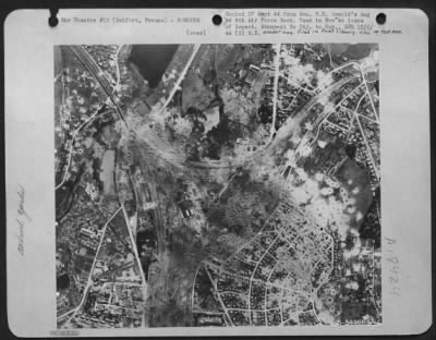 Belfort > Belfort railyards, France after bombing by 8th Air Force on 11 Aug 44. Cumulative results show locomotive shops almost totally destroyed, trans-shipment shed and station shattered, all thorugh lines cut.