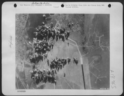 Thumbnail for Istres-Le-Tube > At the peak of the attack, the bomb-pattern blankets the hangars and administration buildings of the Istres Le Tube Airdrome in Southern France, base for long-range Nazi planes. The date: the day before the Allied landings south of Rome on Jan 22.