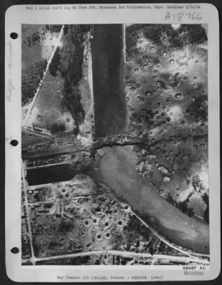 Joigny > At Joigny, France about 80 miles SE of Paris, the main bridge can be observed after direct  hits had severed it in many places, putting it out of service temporarily. This was the result of the 8th Air Force bomber attack there on 10 Aug 44.