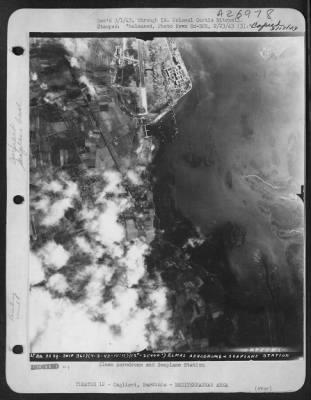 Thumbnail for Consolidated > The U.S. Army's Air Force dealt a heavy blow in early February, 1943, to the airdrome and seaplane base at Cagliari, Sardinia. Striking in broad daylight, Flying Fortresses and Martin Marauder bombers showered the Axis fields with high explosive and