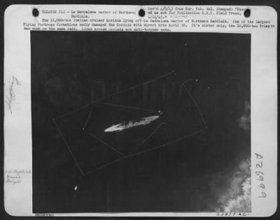 Thumbnail for Consolidated > The 11,000-ton Italian cruiser Gorizia lying off La Maddalena harbor of Northern Sardinia. One of the largest Flying Fortress formations badly damaged the Gorizia with direct hits April 10. It's sister ship, the 10,000-ton Trieste was sunk on the