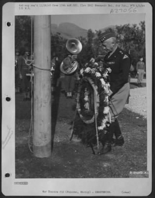 Consolidated > Commemorating the first Armistice day on Axis soil, Lt. Gen. George S. Patton, Commanding Gen. 7th Army, places a wreath on the flag pole in an american war cemetery at Palermo, Sicily.