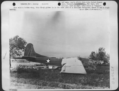 Thumbnail for Consolidated > Bird with a broken wing, this CG-4A glider is in the back yard of a Sicilian farmhouse, where it has a rough landing.