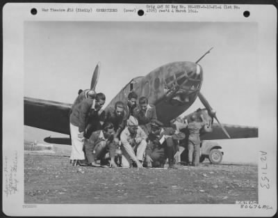 Thumbnail for Consolidated > A U.S. army officer checks over maps with the pilot and crew of an Italian Bergamaschi "Ghibli," twin-engine light general purpose monoplane (shown in background) at an airfield at Palermo.