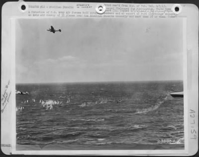 Thumbnail for Consolidated > A formation of U.S. Army Air Forces B-25 Mitchell bombers and an escort of P-38 Lightnings engaged an Axis air convoy of 35 planes over the Sicilian Straits recently and shot down 25 of them. This picture taken during part of the action shows Axis